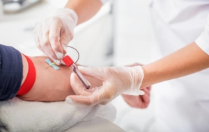 Patient getting their blood drawn by nurse