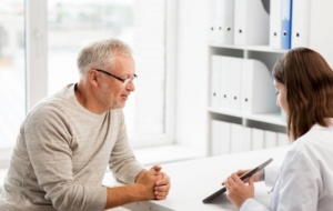 Patient discussing potential risks in doctors office