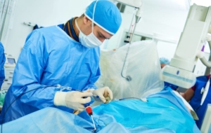 Doctor using catheter to treat patient nonsurgically