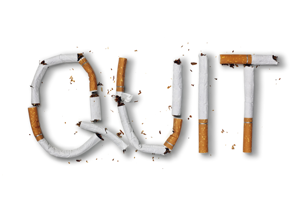 Quit smoking word written with broken cigarette concept for quitting smoking