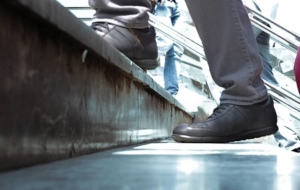 Man having pain walking up stairs