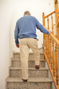 Older Man Climbing the Stairs