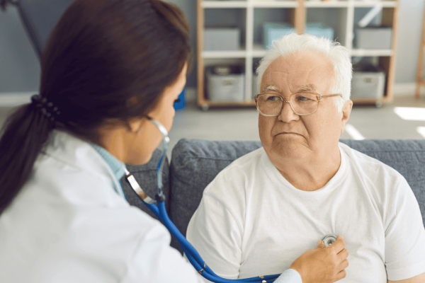 Female doctor speaking to male patient about pad