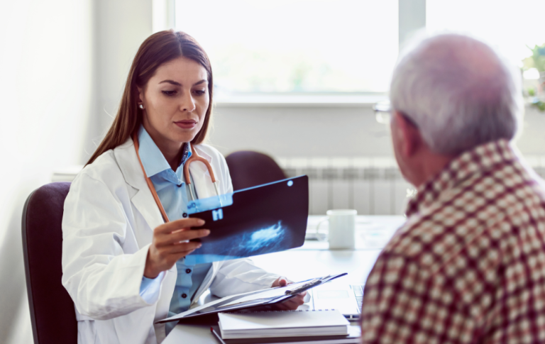 PA vascular specialist reviewing test results for an elderly patient.