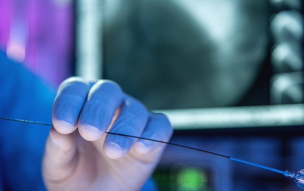 Doctor holding an angioplasty catheter.