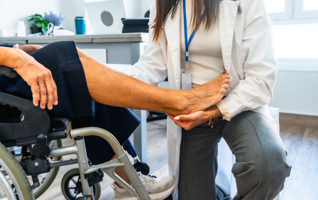 Doctor examining a woman's leg.