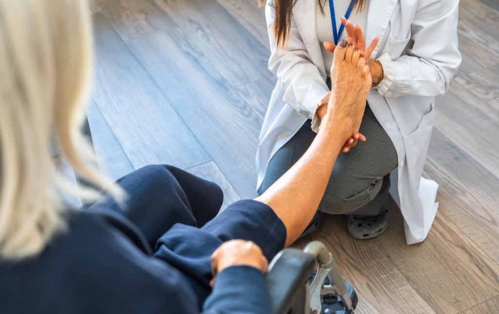 Vascular specialist examining woman's foot to check circulation.